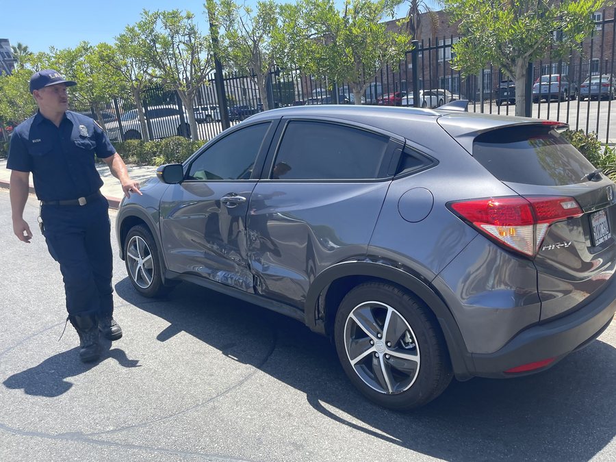 Side-impact damage on a Honda HR-V being assessed
